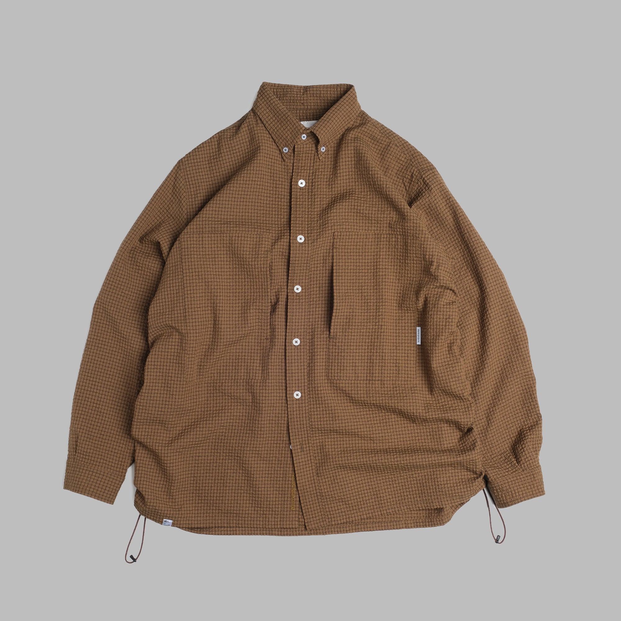 Brown checkered jacket on a gray background
